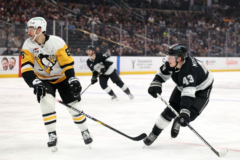 Jan 20, 2025; Los Angeles, California, USA;  Los Angeles Kings defenseman Jacob Moverare (43) looks at the puck after shooting it during the second period against the Pittsburgh Penguins at Crypto.com Arena. Mandatory Credit: Kiyoshi Mio-Imagn Images