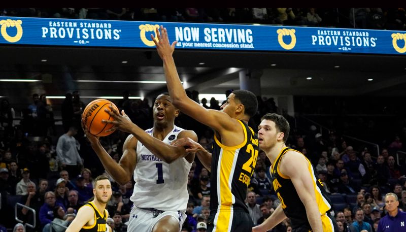 Feb 19, 2023; Evanston, Illinois, USA; Iowa Hawkeyes forward Kris Murray (24) defends Northwestern Wildcats guard Chase Audige (1) during the second half at Welsh-Ryan Arena. Mandatory Credit: David Banks-USA TODAY Sports