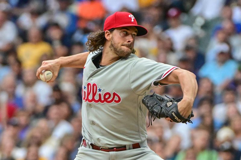 Sep 2, 2023; Milwaukee, Wisconsin, USA;  Philadelphia Phillies pitcher Aaron Nola (27) pitches in the first inning against the Milwaukee Brewers at American Family Field. Mandatory Credit: Benny Sieu-USA TODAY Sports