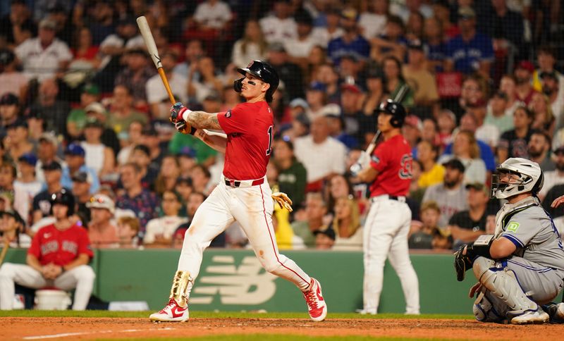 Aug 26, 2024; Boston, Massachusetts, USA; Boston Red Sox center fielder Jarren Duran (16) hits a two run home run against the Toronto Blue Jays in the eighth inning at Fenway Park. Mandatory Credit: David Butler II-USA TODAY Sports