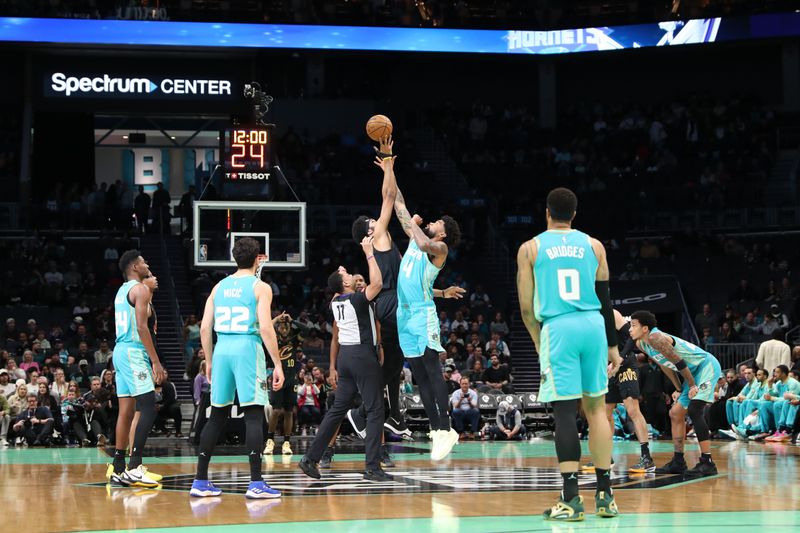 CHARLOTTE, NC - MARCH 27: Jarrett Allen #31 of the Cleveland Cavaliers and Nick Richards #4 of the Charlotte Hornets go up for the opening tip off on March 27, 2024 at Spectrum Center in Charlotte, North Carolina. NOTE TO USER: User expressly acknowledges and agrees that, by downloading and or using this photograph, User is consenting to the terms and conditions of the Getty Images License Agreement.  Mandatory Copyright Notice:  Copyright 2024 NBAE (Photo by Brock Williams-Smith/NBAE via Getty Images)