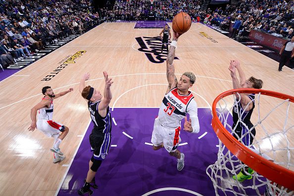 SACRAMENTO, CA - DECEMBER 18: Kyle Kuzma #33 of the Washington Wizards rebounds the ball during the game against the Sacramento Kings on December 18, 2023 at Golden 1 Center in Sacramento, California. NOTE TO USER: User expressly acknowledges and agrees that, by downloading and or using this Photograph, user is consenting to the terms and conditions of the Getty Images License Agreement. Mandatory Copyright Notice: Copyright 2023 NBAE (Photo by Rocky Widner/NBAE via Getty Images)