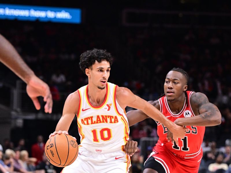 ATLANTA, GA - NOVEMBER 9: Zaccharie Risacher #10 of the Atlanta Hawks dribbles the ball during the game against the Chicago Bulls on November 9, 2024 at State Farm Arena in Atlanta, Georgia.  NOTE TO USER: User expressly acknowledges and agrees that, by downloading and/or using this Photograph, user is consenting to the terms and conditions of the Getty Images License Agreement. Mandatory Copyright Notice: Copyright 2024 NBAE (Photo by Adam Hagy/NBAE via Getty Images)