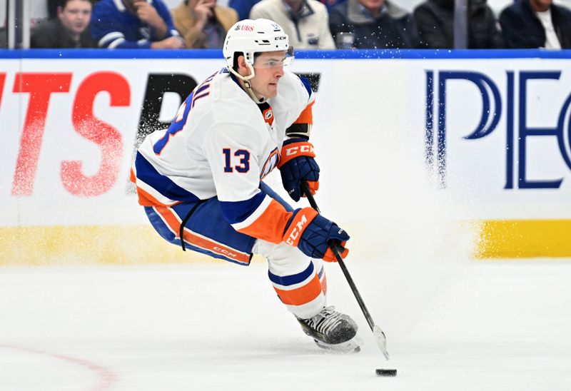 Feb 5, 2024; Toronto, Ontario, CAN;   New York Islanders forward Mathew Barzal (13) skates with the puck against the Toronto Maple Leafs in the first period at Scotiabank Arena. Mandatory Credit: Dan Hamilton-USA TODAY Sports