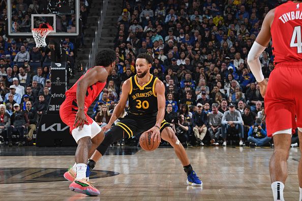 SAN FRANCISCO, CA - DECEMBER 23: Stephen Curry #30 of the Golden State Warriors dribbles the ball during the game against the Portland Trail Blazers on December 23, 2023 at Chase Center in San Francisco, California. NOTE TO USER: User expressly acknowledges and agrees that, by downloading and or using this photograph, user is consenting to the terms and conditions of Getty Images License Agreement. Mandatory Copyright Notice: Copyright 2023 NBAE (Photo by Noah Graham/NBAE via Getty Images)