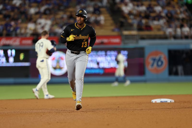 Aug 10, 2024; Los Angeles, California, USA;  Pittsburgh Pirates third baseman Ke'Bryan Hayes (13) runs around bases after hitting a home run during the ninth inning against the Los Angeles Dodgers at Dodger Stadium. Mandatory Credit: Kiyoshi Mio-USA TODAY Sports