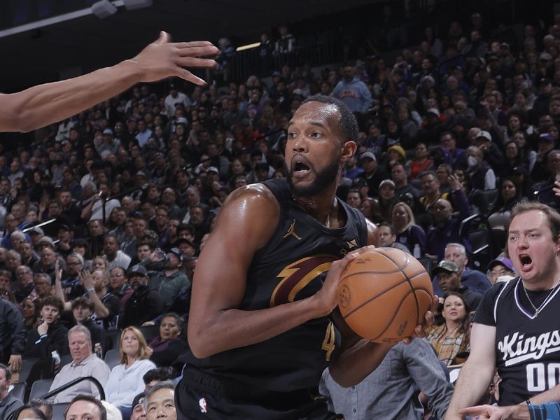 SACRAMENTO, CA - MARCH 19:   Evan Mobley #4 of the Cleveland Cavaliers dribbles the ball during the game against the Sacramento Kings on March 19, 2025 at Golden 1 Center in Sacramento, California. NOTE TO USER: User expressly acknowledges and agrees that, by downloading and or using this Photograph, user is consenting to the terms and conditions of the Getty Images License Agreement. Mandatory Copyright Notice: Copyright 2025 NBAE (Photo by Rocky Widner/NBAE via Getty Images)