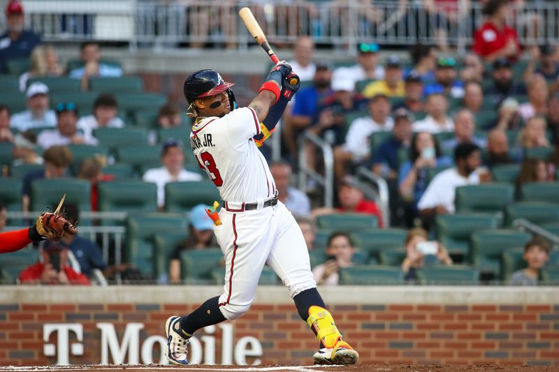 Sep 7, 2023; Atlanta, Georgia, USA; Atlanta Braves right fielder Ronald Acuna Jr. (13) hits a home run against the St. Louis Cardinals in the first inning at Truist Park. Mandatory Credit: Brett Davis-USA TODAY Sports
