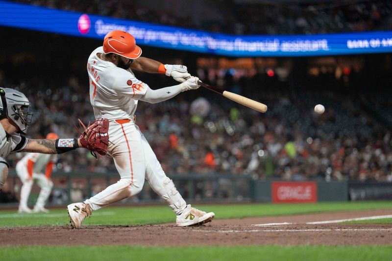 Aug 20, 2024; San Francisco, California, USA;  San Francisco Giants outfielder Heliot Ramos (17) hits an RBI single during the fifth inning against the Chicago White Sox at Oracle Park. Mandatory Credit: Stan Szeto-USA TODAY Sports