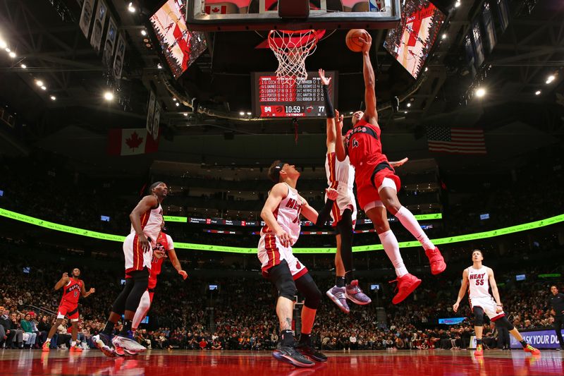 TORONTO, CANADA - JANUARY 17: Scottie Barnes #4 of the Toronto Raptors drives to the basket during the game against the Miami Heat on January 17, 2024 at the Scotiabank Arena in Toronto, Ontario, Canada.  NOTE TO USER: User expressly acknowledges and agrees that, by downloading and or using this Photograph, user is consenting to the terms and conditions of the Getty Images License Agreement.  Mandatory Copyright Notice: Copyright 2024 NBAE (Photo by Vaughn Ridley/NBAE via Getty Images)