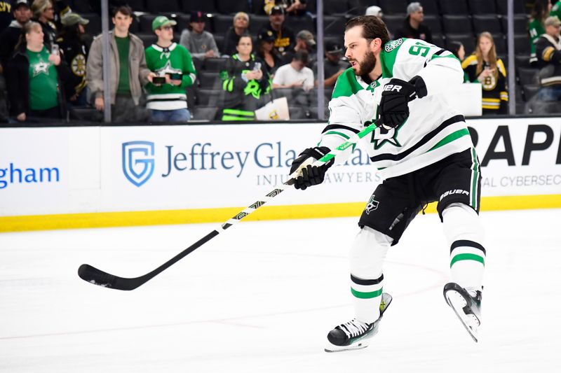 Oct 24, 2024; Boston, Massachusetts, USA;  Dallas Stars center Tyler Seguin (91) shoots the puck during warmups prior to a game against the Boston Bruins at TD Garden. Mandatory Credit: Bob DeChiara-Imagn Images