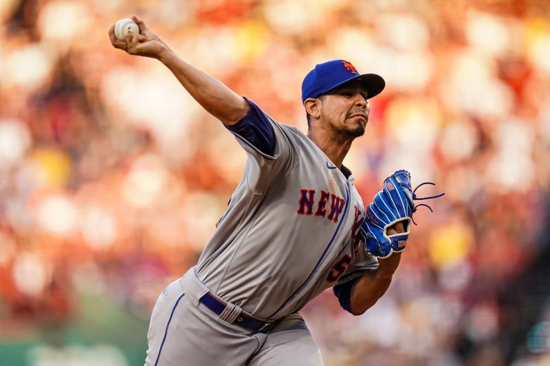 Jul 23, 2023; Boston, Massachusetts, USA; New York Mets starting pitcher Carlos Carrasco (59) throws a pitch against the Boston Red Sox in the first inning at Fenway Park. Mandatory Credit: David Butler II-USA TODAY Sports