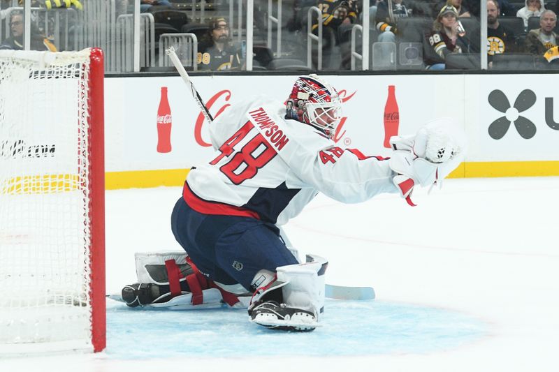 Sep 21, 2025; Boston, Massachusetts, USA;  Washington Capitals goaltender Logan Thompson (48) makes a save during the first period against the Boston Bruins at TD Garden. Mandatory Credit: Bob DeChiara-Imagn Images