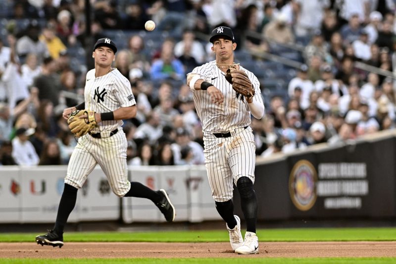 May 9, 2024; Bronx, New York, USA; New York Yankees third baseman Oswaldo Cabrera (95) fields a ground ball and throws to first base for an out during the seventh inning against the Houston Astros at Yankee Stadium. Mandatory Credit: John Jones-USA TODAY Sports