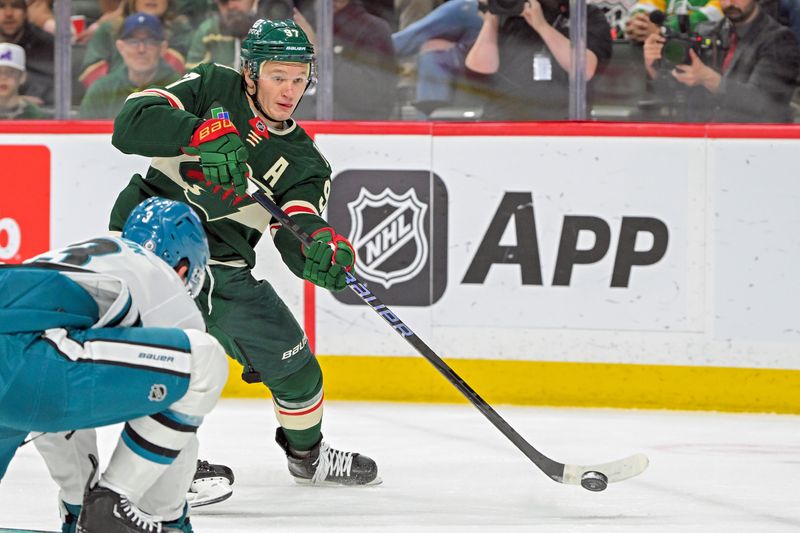 Apr 9, 2025; Saint Paul, Minnesota, USA;  Minnesota Wild forward Kiril Kaprizov (97) takes a shot on goal against the San Jose Sharks during the first period at Xcel Energy Center. Mandatory Credit: Nick Wosika-Imagn Images