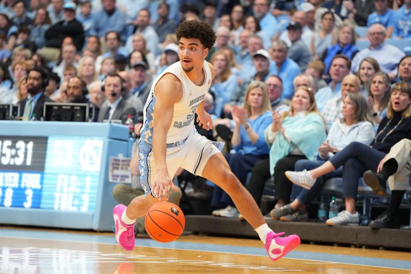 Feb 14, 2026; Chapel Hill, North Carolina, USA; North Carolina Tar Heels guard Derek Dixon (3) brings the ball up the court in the second half at Dean E. Smith Center. Mandatory Credit: Bob Donnan-Imagn Images