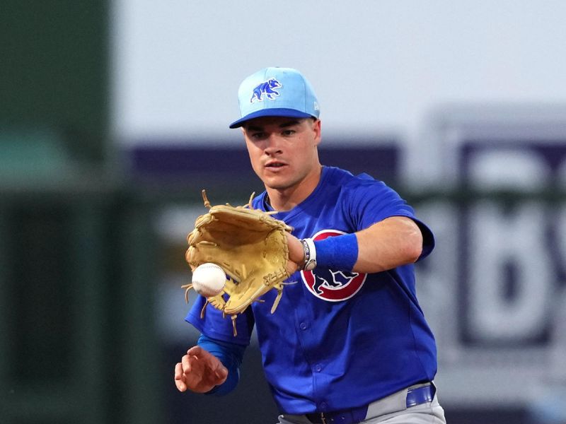 Mar 5, 2024; Surprise, Arizona, USA; Chicago Cubs second baseman Miles Mastrobuoni (20) fields a ground ball against the Kansas City Royals during the second inning at Surprise Stadium. Mandatory Credit: Joe Camporeale-USA TODAY Sports