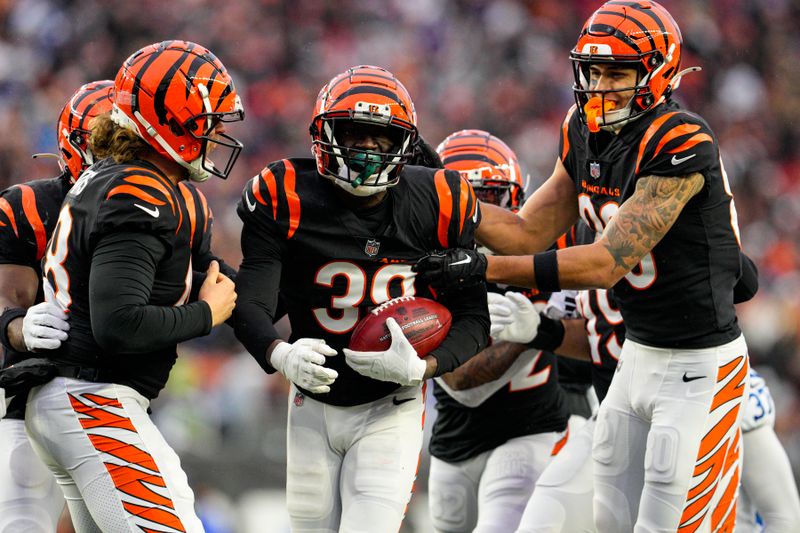 Cincinnati Bengals cornerback DJ Ivey (38) celebrates a fumble recovery against the Indianapolis Colts in the second half of an NFL football game in Cincinnati, Sunday, Dec. 10, 2023. (AP Photo/Jeff Dean)