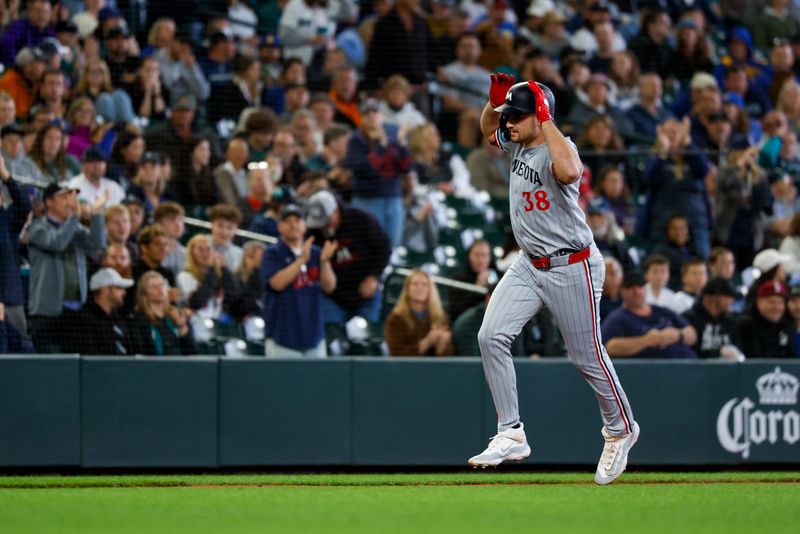 May 31, 2025; Seattle, Washington, USA; Minnesota Twins right fielder Matt Wallner (38) celebrates while running the bases after hitting a two-run home run against the Seattle Mariners during the second inning at T-Mobile Park. Mandatory Credit: Joe Nicholson-Imagn Images
