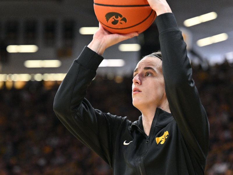 Mar 3, 2024; Iowa City, Iowa, USA; Iowa Hawkeyes guard Caitlin Clark (22) warms up before the game against the Ohio State Buckeyes at Carver-Hawkeye Arena. Clark is attempting to break the NCAA basketball all-time scoring record. Mandatory Credit: Jeffrey Becker-USA TODAY Sports