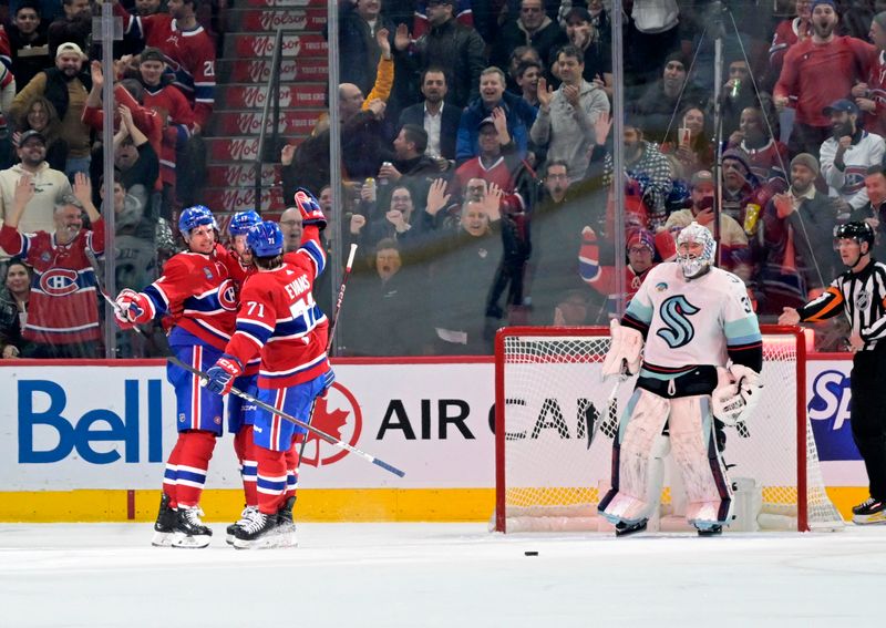 Dec 4, 2023; Montreal, Quebec, CAN; Montreal Canadiens forward Sean Monahan (91) celebrates with teammates after scoring a goal against Seattle Kraken goalie Philipp Grubauer (31) during the first period at the Bell Centre. Mandatory Credit: Eric Bolte-USA TODAY Sports