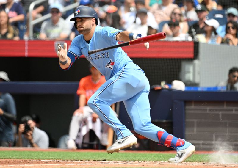 Jul 4, 2024; Toronto, Ontario, CAN; Toronto Blue Jays center fielder Kevin Kiermaier (39) runs to first base after bunting the ball against the Houston Astros in the fifth inning at Rogers Centre. Mandatory Credit: Dan Hamilton-USA TODAY Sports