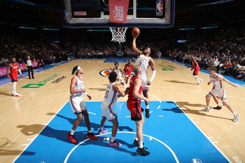 OKLAHOMA CITY, OK - OCTOBER 9: Dillon Jones #3 of the Oklahoma City Thunder goes up for the rebound during the game against the Houston Rockets during a NBA pre season game on October 9, 2024 at Paycom Center in Oklahoma City, Oklahoma. NOTE TO USER: User expressly acknowledges and agrees that, by downloading and or using this photograph, User is consenting to the terms and conditions of the Getty Images License Agreement. Mandatory Copyright Notice: Copyright 2024 NBAE (Photo by Zach Beeker/NBAE via Getty Images)