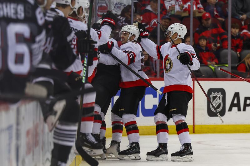 Mar 23, 2024; Newark, New Jersey, USA; Ottawa Senators defenseman Thomas Chabot (72) celebrates his goal against the New Jersey Devils during the second period at Prudential Center. Mandatory Credit: Ed Mulholland-USA TODAY Sports