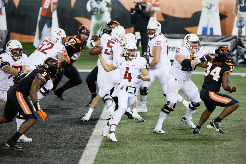 Nov 7, 2020; Corvallis, Oregon, USA; Washington State Cougars quarterback Jayden de Laura (4) throws a pass against the Oregon State Beavers during the first half at Reser Stadium. Mandatory Credit: Soobum Im-USA TODAY Sports