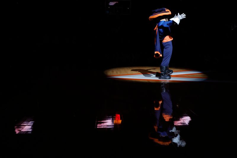 Jan 28, 2023; Charlottesville, Virginia, USA; Virginia Cavaliers mascot Cat Man dances on the court prior to the Cavaliers' game against the Boston College Eagles at John Paul Jones Arena. Mandatory Credit: Geoff Burke-USA TODAY Sports