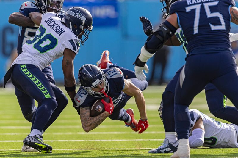 Tennessee Titans wide receiver Mason Kinsey (12) dives for yardage during their NFL football game against the Seattle Seahawks Sunday, Dec. 24, 2023, in Nashville, Tenn. (AP Photo/Wade Payne)