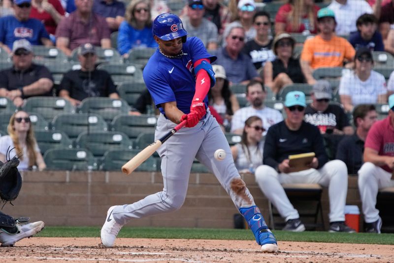 Mar 8, 2024; Salt River Pima-Maricopa, Arizona, USA; Chicago Cubs second baseman Christopher Morel (5) hits against the Arizona Diamondbacks in the fourth inning at Salt River Fields at Talking Stick. Mandatory Credit: Rick Scuteri-USA TODAY Sports