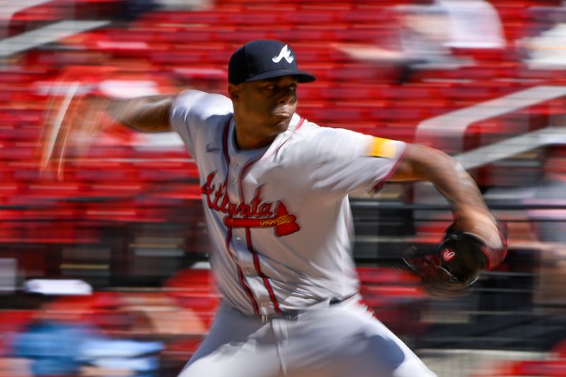 Jun 26, 2024; St. Louis, Missouri, USA; Atlanta Braves relief pitcher Raisel Iglesias (26) pitches against the St. Louis Cardinals during the ninth inning at Busch Stadium. Mandatory Credit: Jeff Curry-USA TODAY Sports