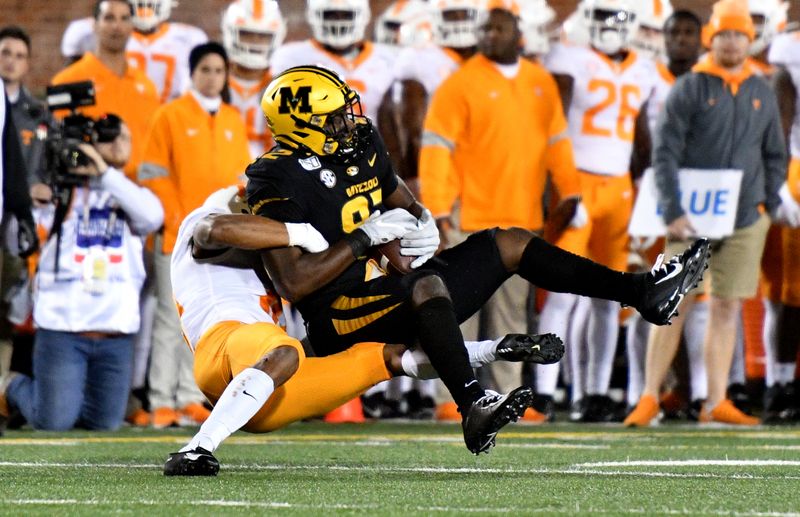 Nov 23, 2019; Columbia, MO, USA;Missouri Tigers tight end Daniel Parker Jr. (82) is tackled by Tennessee Volunteers defensive back Jay Shoop (10) during the first half at Memorial Stadium/Faurot Field. Mandatory Credit: Denny Medley-USA TODAY Sports