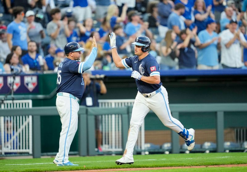 May 3, 2024; Kansas City, Missouri, USA; Kansas City Royals outfielder Hunter Renfroe (16) is congratulated by third base coach Vance Wilson (25) after hitting a home run  during the fifth inning against the Texas Rangers at Kauffman Stadium. Mandatory Credit: Jay Biggerstaff-USA TODAY Sports