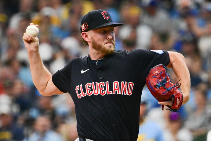 Aug 17, 2024; Milwaukee, Wisconsin, USA; Cleveland Guardians starting pitcher Tanner Bibee (28) pitches against the Milwaukee Brewers in the first inning at American Family Field. Mandatory Credit: Benny Sieu-USA TODAY Sports