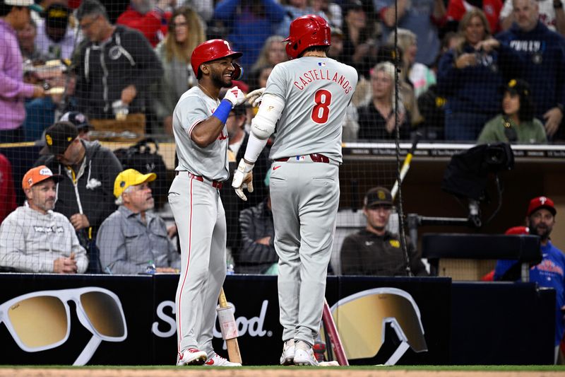 Apr 26, 2024; San Diego, California, USA; Philadelphia Phillies right fielder Nick Castellanos (8) is congratulated by center fielder Johan Rojas (18) after hitting a home run against the San Diego Padres during the third inning at Petco Park. Mandatory Credit: Orlando Ramirez-USA TODAY Sports