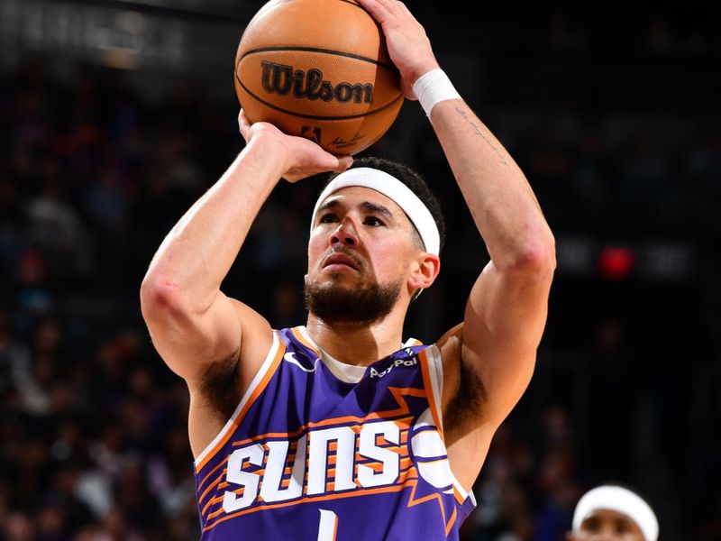 PHOENIX, AZ - NOVEMBER 30: Devin Booker #1 of the Phoenix Suns shoots a free throw during the game against the Golden State Warriors on November 30, 2024 at Footprint Center in Phoenix, Arizona. NOTE TO USER: User expressly acknowledges and agrees that, by downloading and or using this photograph, user is consenting to the terms and conditions of the Getty Images License Agreement. Mandatory Copyright Notice: Copyright 2024 NBAE (Photo by Barry Gossage/NBAE via Getty Images)