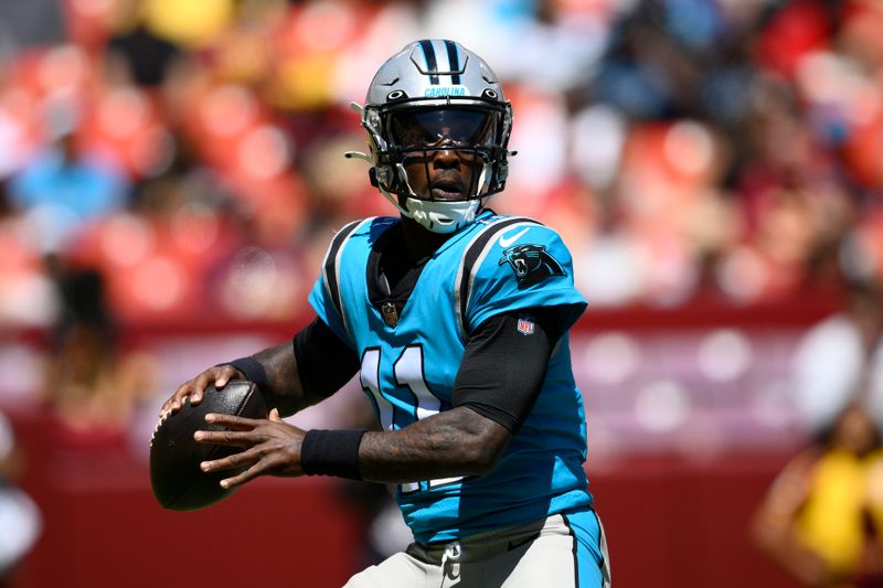 Carolina Panthers quarterback PJ Walker (11) in action during the first half of a preseason NFL football game against the Washington Commanders, Saturday, Aug. 13, 2022, in Landover, Md. (AP Photo/Nick Wass)