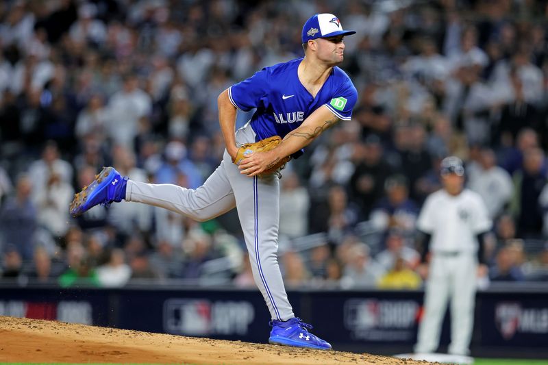 Oct 8, 2025; Bronx, New York, USA; Toronto Blue Jays pitcher Mason Fluharty (68) pitches during the third inning against the New York Yankees during game four of the ALDS round for the 2025 MLB playoffs at Yankee Stadium. Mandatory Credit: Brad Penner-Imagn Images