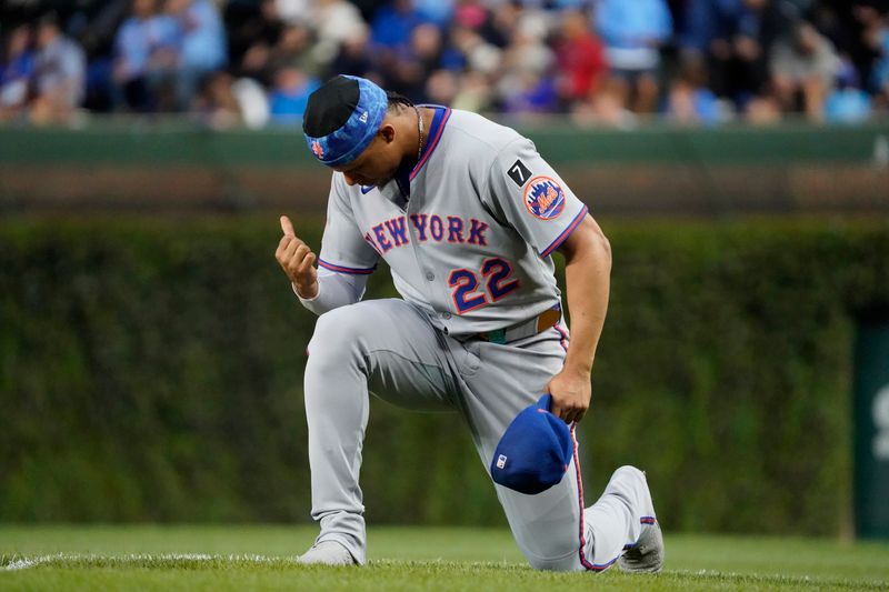 Sep 23, 2025; Chicago, Illinois, USA; New York Mets outfielder Juan Soto (22) prays before a game against the Chicago Cubs at Wrigley Field. Mandatory Credit: David Banks-Imagn Images