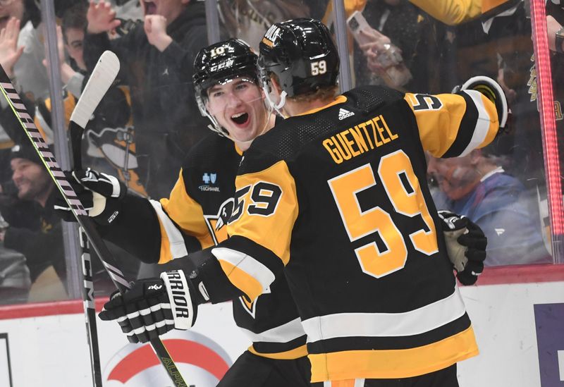 Nov 25, 2023; Pittsburgh, Pennsylvania, USA; Pittsburgh Penguins left wing Jake Guentzel (59) celebrates a goal with left wing Drew O   Connor against the Toronto Maple Leafs during the first period at PPG Paints Arena. Mandatory Credit: Philip G. Pavely-USA TODAY Sports