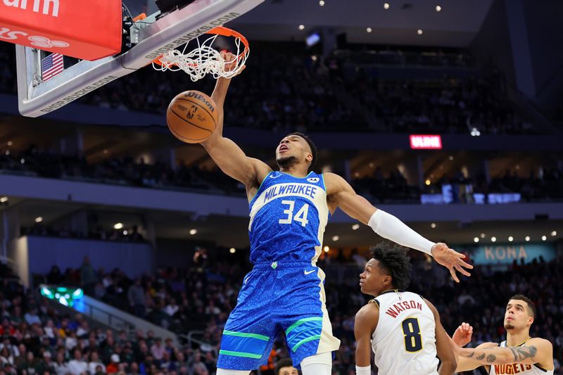 MILWAUKEE, WISCONSIN - FEBRUARY 12: Giannis Antetokounmpo #34 of the Milwaukee Bucks dunks against the Denver Nuggets during the first half of a game at Fiserv Forum on February 12, 2024 in Milwaukee, Wisconsin. NOTE TO USER: User expressly acknowledges and agrees that, by downloading and or using this photograph, User is consenting to the terms and conditions of the Getty Images License Agreement. (Photo by Stacy Revere/Getty Images)