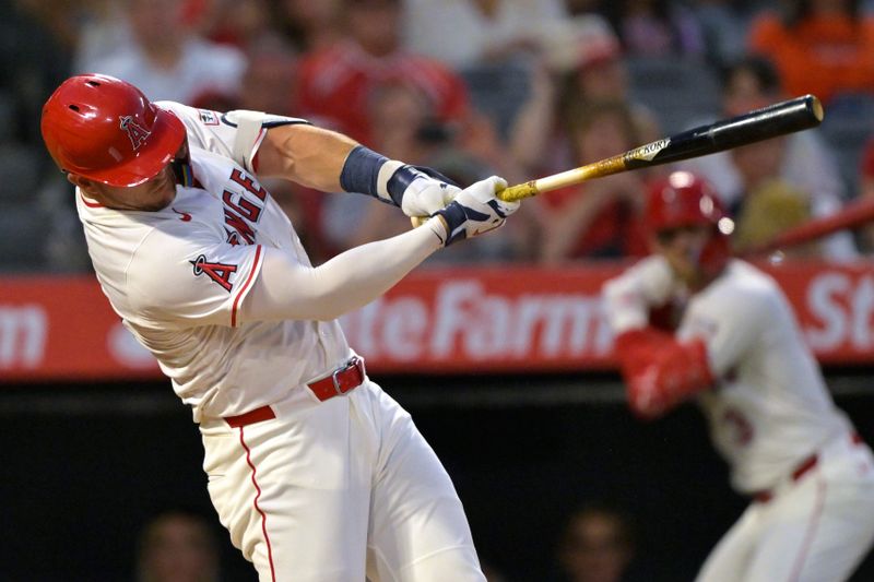 Jun 28, 2025; Anaheim, California, USA;  Los Angeles Angels right fielder Mike Trout (27) hits a solo home run in the seventh inning against the Washington Nationals at Angel Stadium. Mandatory Credit: Jayne Kamin-Oncea-Imagn Images