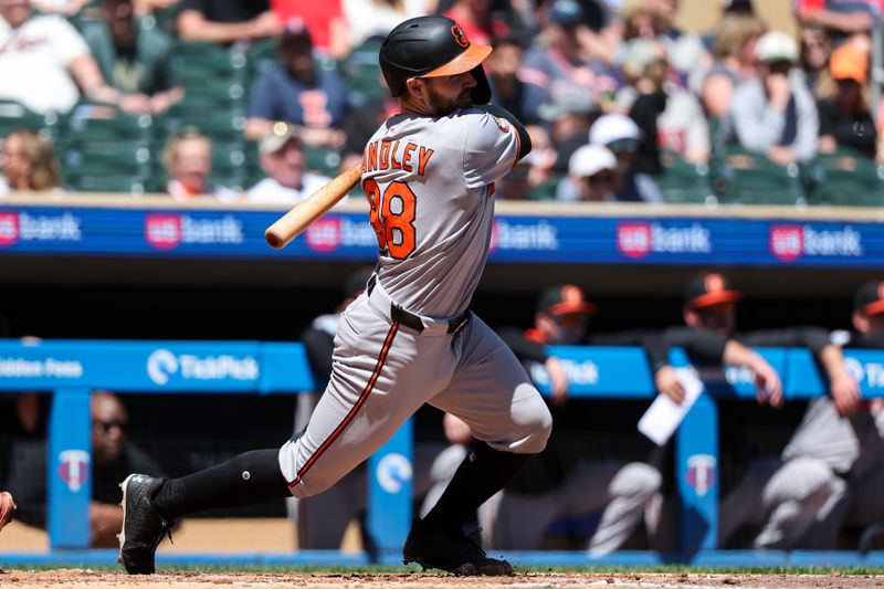 May 8, 2025; Minneapolis, Minnesota, USA; Baltimore Orioles catcher Maverick Handley (98) hits his first career base hit against the Minnesota Twins during the fourth inning at Target Field. Mandatory Credit: Matt Krohn-Imagn Images