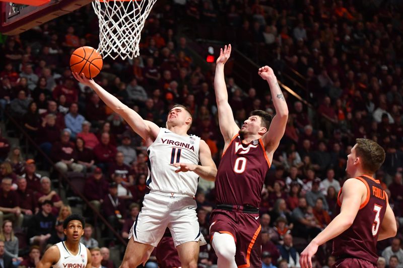 Feb 19, 2024; Blacksburg, Virginia, USA; Virginia Cavaliers guard Isaac McKneely (11) shoots against Virginia Tech Hokies guard Hunter Cattoor (0) during the first half at Cassell Coliseum. Mandatory Credit: Brian Bishop-USA TODAY Sports