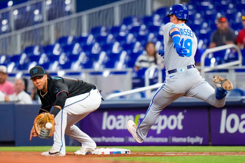 Jun 7, 2023; Miami, Florida, USA; Miami Marlins first baseman Yuli Gurriel (10) forces out Kansas City Royals second baseman Michael Massey (19) during the second inning at loanDepot Park. Mandatory Credit: Rich Storry-USA TODAY Sports