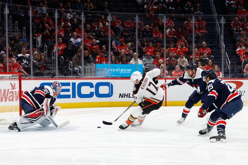 Jan 16, 2024; Washington, District of Columbia, USA; Anaheim Ducks left wing Alex Killorn (17) skates in on Washington Capitals goaltender Darcy Kuemper (35) as Capitals center Evgeny Kuznetsov (92) defends in the second period at Capital One Arena. Mandatory Credit: Geoff Burke-USA TODAY Sports