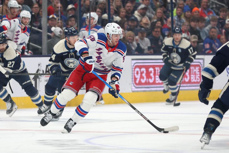 Mar 15, 2025; Columbus, Ohio, USA;  New York Rangers left wing Will Cuylle (50) skates the puck up ice during the first period against the Columbus Blue Jackets at Nationwide Arena. Mandatory Credit: Joseph Maiorana-Imagn Images