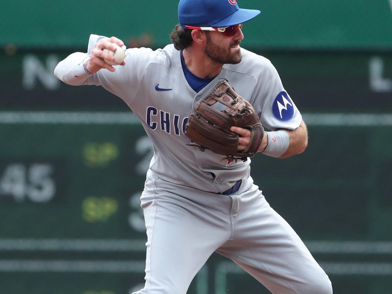 May 1, 2025; Pittsburgh, Pennsylvania, USA;  Chicago Cubs shortstop Dansby Swanson (7) throws to first base to complete a double play against the Pittsburgh Pirates during the second inning at PNC Park. Mandatory Credit: Charles LeClaire-Imagn Images